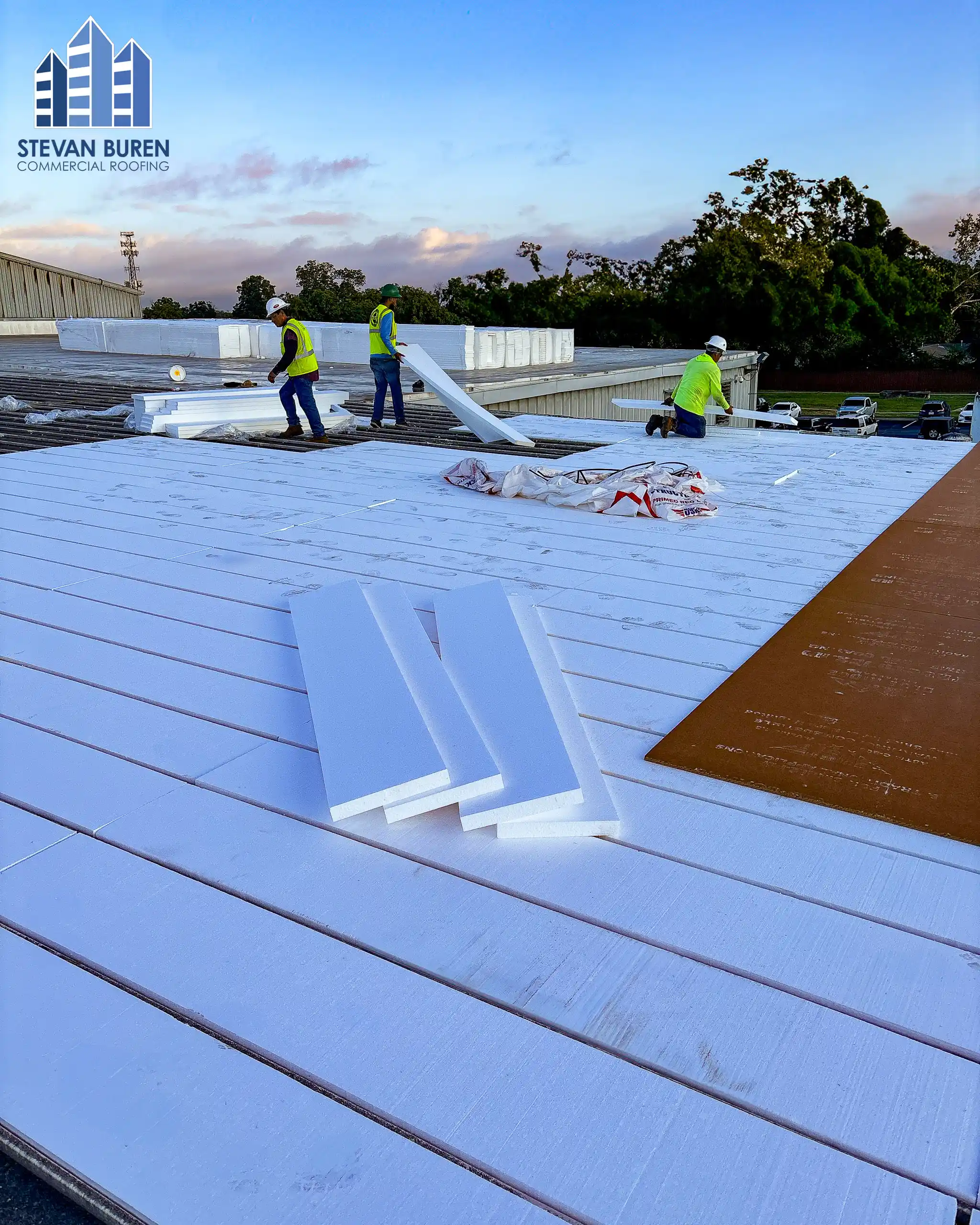 Commercial roof maintenance work on a flat roof membrane