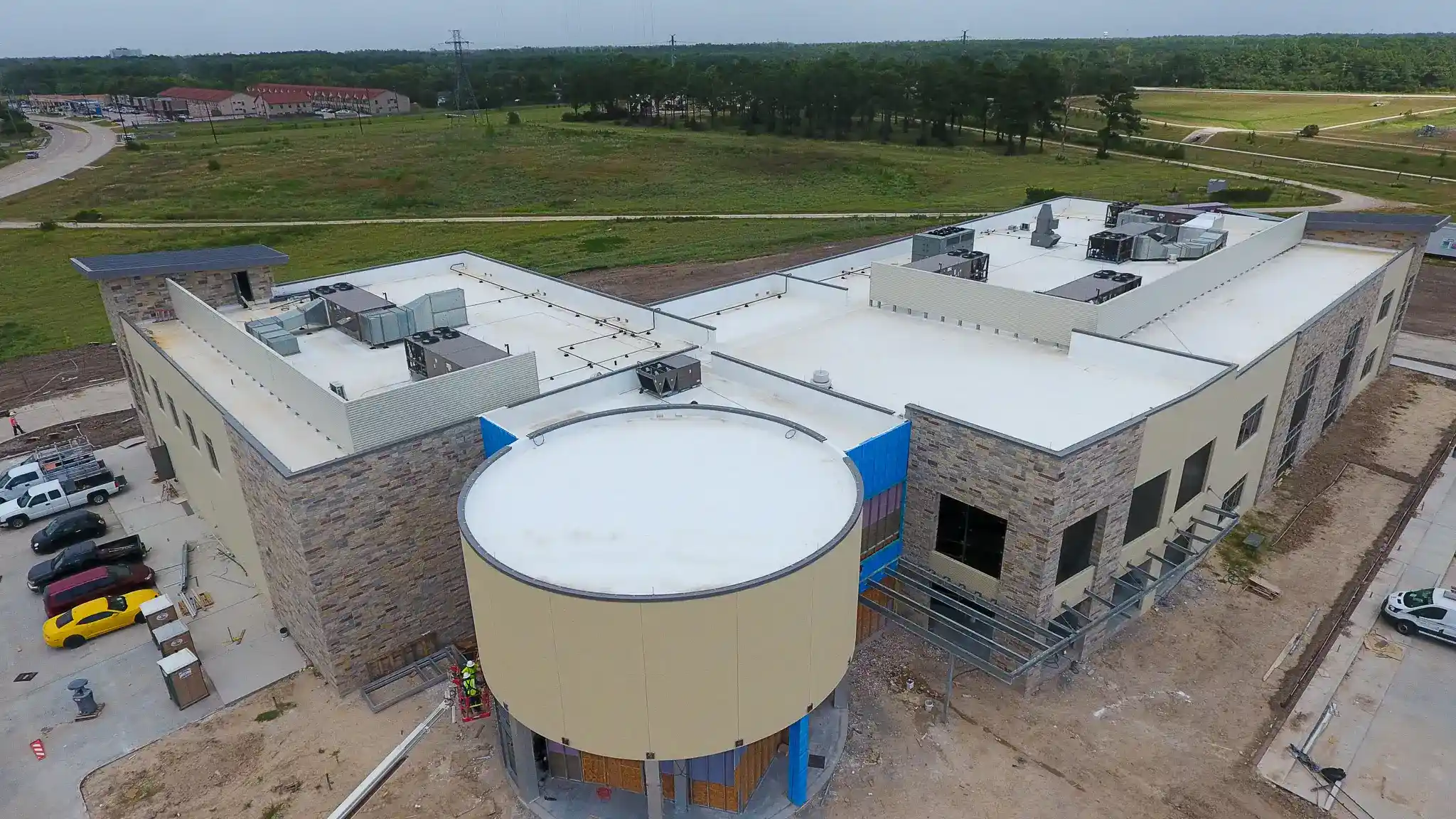 Commercial college building with white TPO flat roofing
